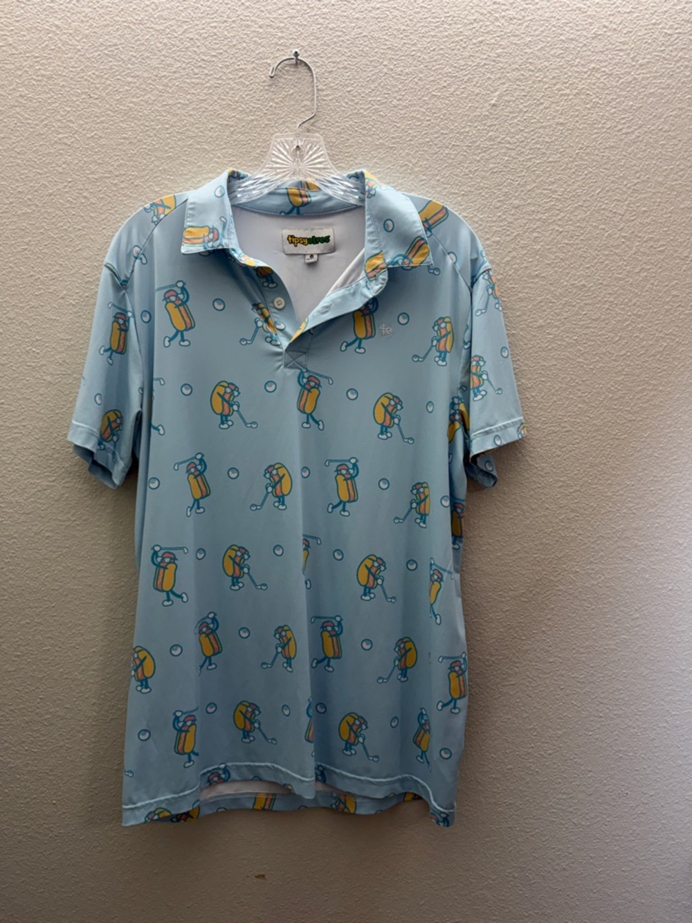 Tipsy Elves Light Blue Polo with Yellow & Teal Cartoon Print
